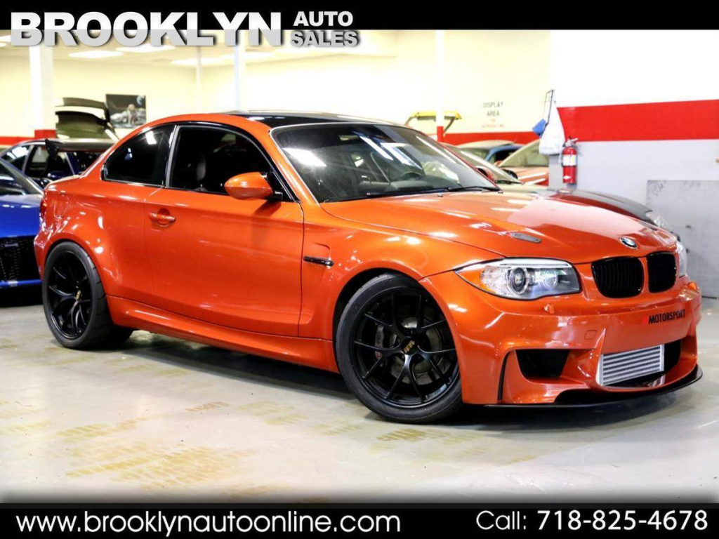 2011 BMW 1-Series M Coupe in Valencia Orange Metallic over Black Boston Leather with Orange Stitching